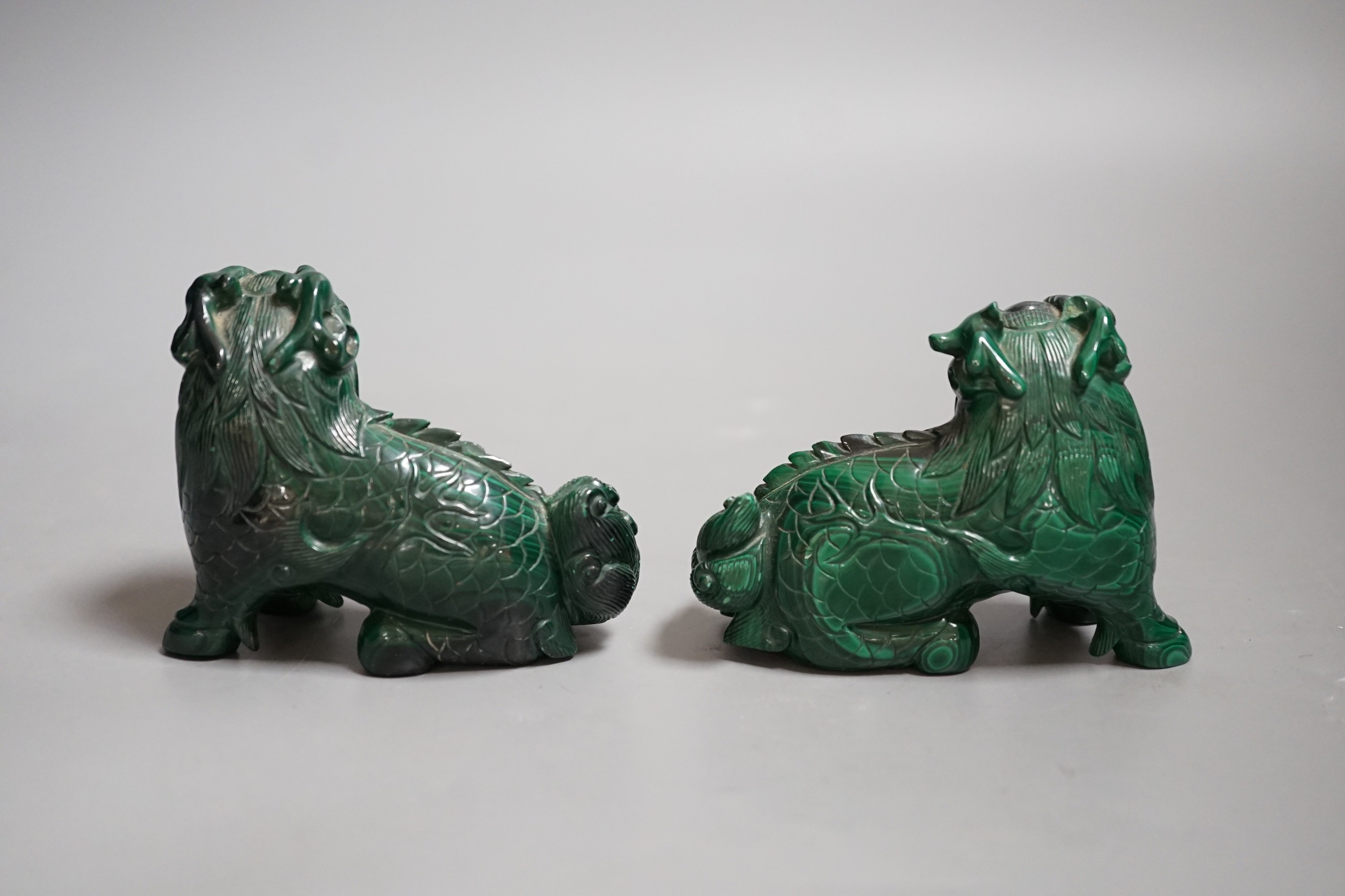 A pair of Chinese carved Lion-dog figures, 6.5cm tall